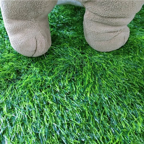 Green washable dog grass pee pad on a patio for pet potty training