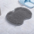 Orange massage bath brush with suction cups and silicone bristles on a 23x30cm TPR mat