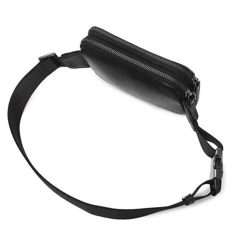 Men's small leather crossbody bag in cowhide showing compact dimensions and urban simplicity styling