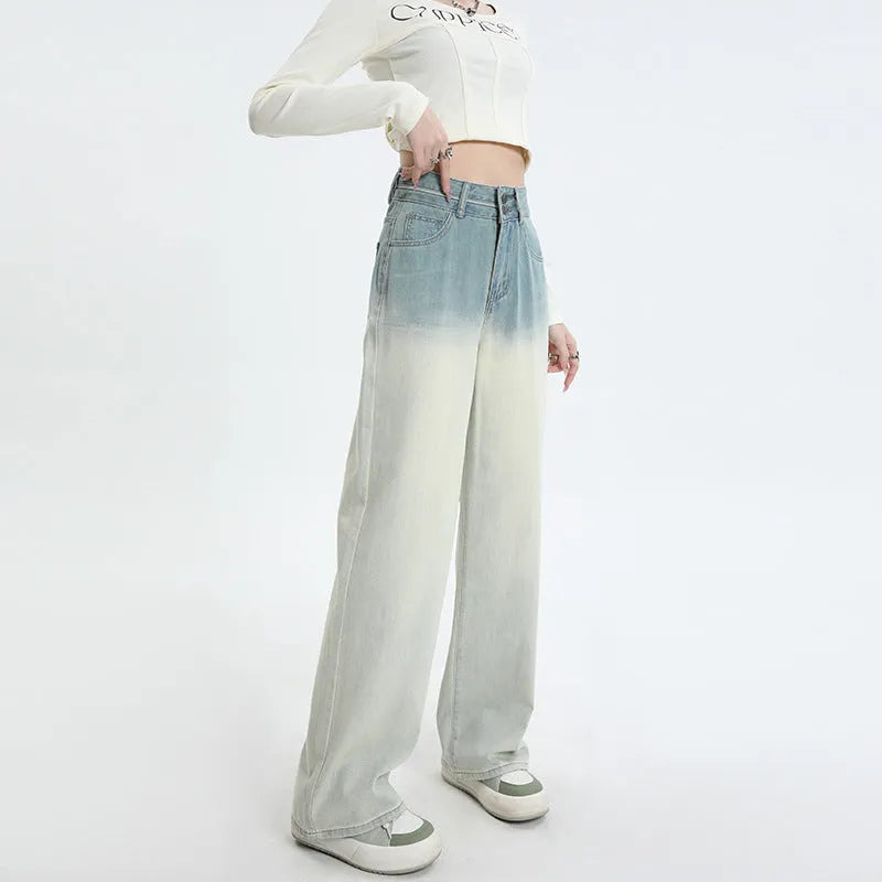 Women's gradient blue straight-leg denim trousers showing colour transition and straight cut silhouette