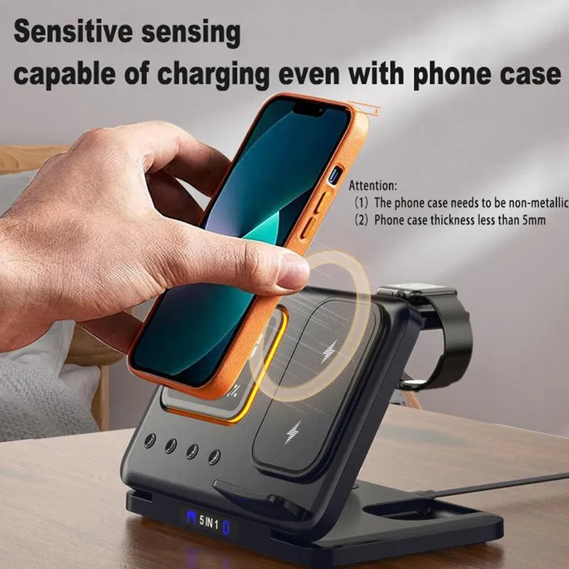 Black and white wireless charging stand with digital clock displaying time and temperature, charging a phone and smartwatch.
