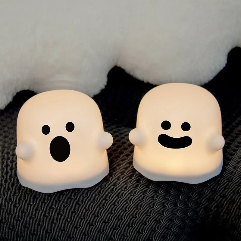 White silicone touch sensor LED night light on a bedside table.