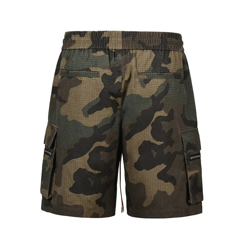 Green camouflage cotton workwear shorts with loose fit and mid waist design