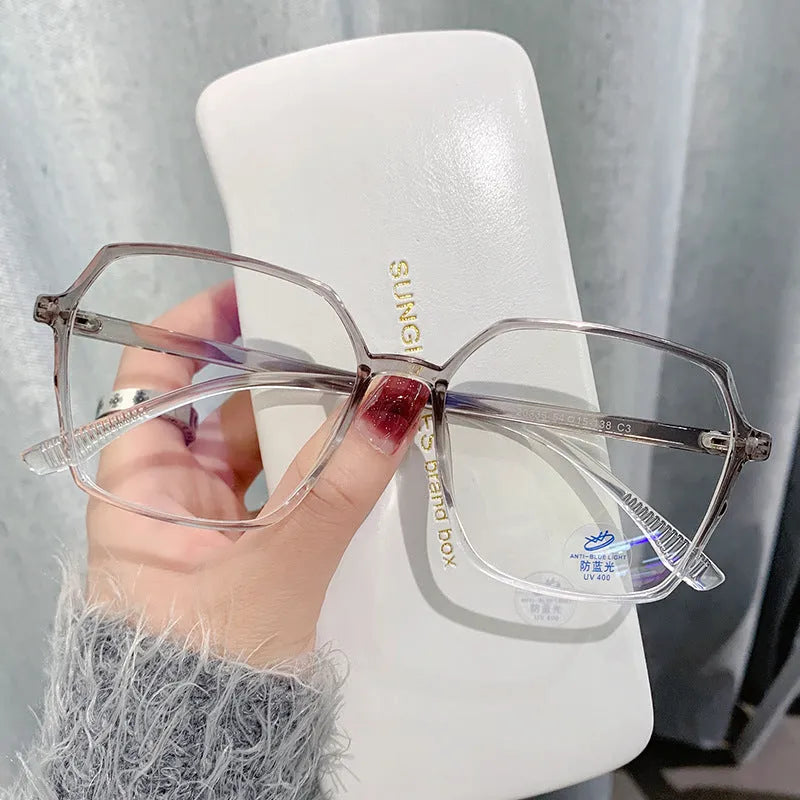 Women's flat glasses with plate frame and AC lenses, shown in black, transparent blue, grey, or tea colour options