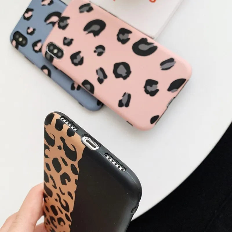 Leopard print pattern phone case for iPhone shown in black, blue, and pink colour options.