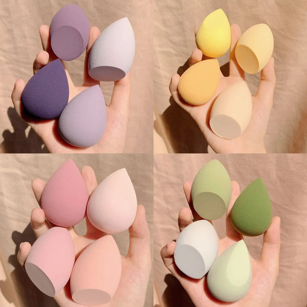 Four makeup egg sponges in grape, mango, mint, and peach colours, each 6cm in size