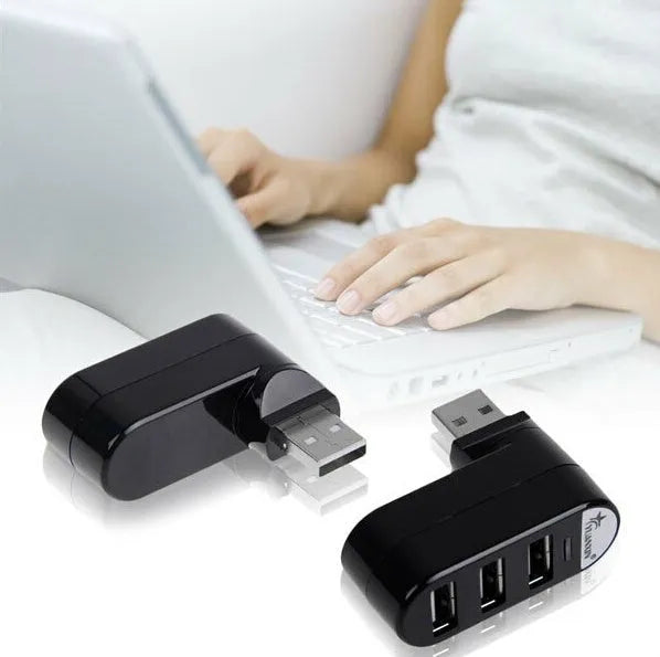 Black USB splitter hub with four 2.0 ports and 15cm cable on wooden desk
