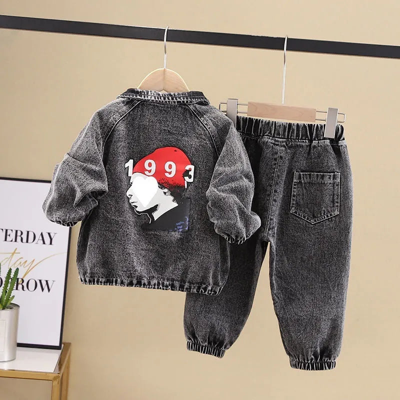 Boys' blue denim two-piece suit set with long sleeves, showing top and trousers laid flat.