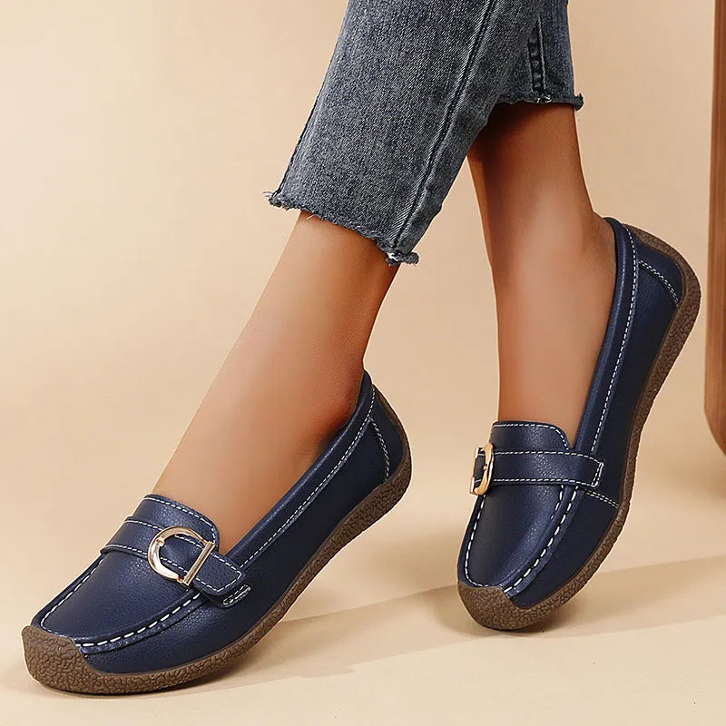 Women's beige casual loafers with round toe, flat heel, and shallow slip-on design.