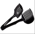 Green plastic fruit and vegetable cutting holder with slicing grid, measuring 18.5 cm.