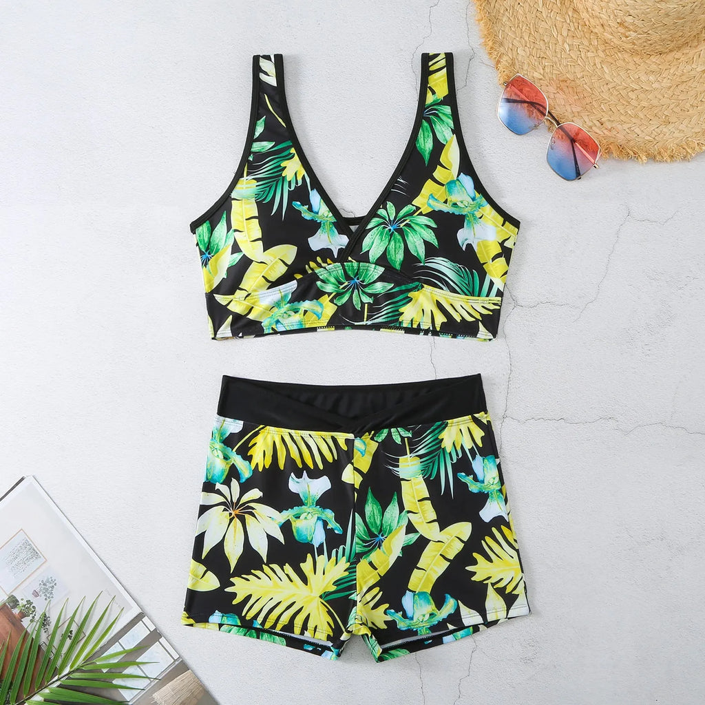 Two-piece swimsuit with printed boxer briefs in multiple colours, sleeveless top, and briefs style for female swimmers