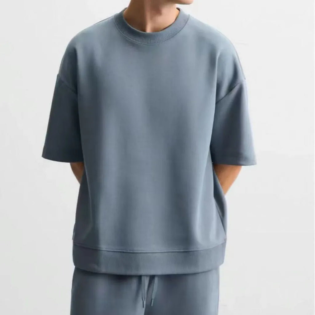 Loose double-sided cloth texture short sleeve top and shorts set in blue, showing round collar and loose fit