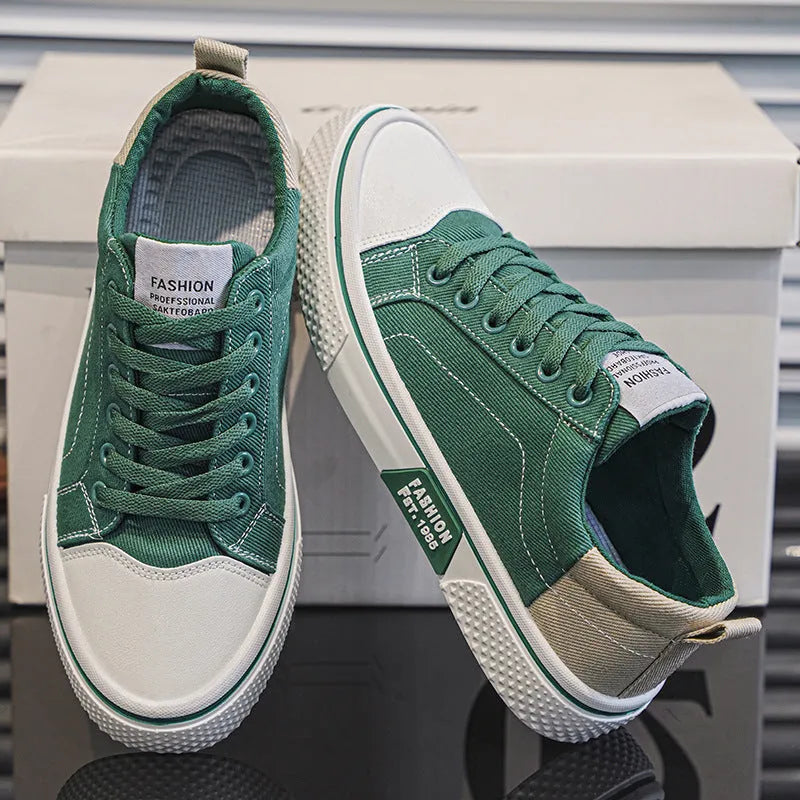 Men's low-top blue canvas shoes with round toe and white stitching on a soft PVC sole.