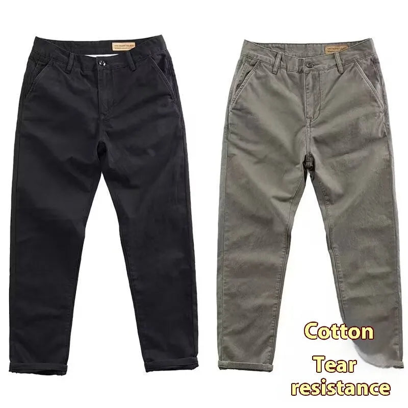 Men's slim-fit casual trousers in a micro elastic fabric, shown in a straight-leg cut and solid colour.