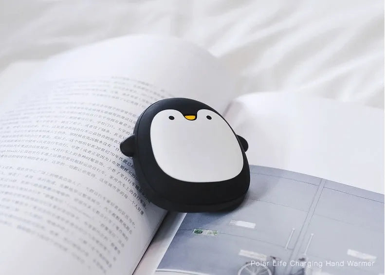 Cartoon penguin polar bear design USB hand warmer showing double-side heating and compact 83x78x35mm dimensions