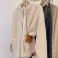Beige viscose sweater coat cardigan with long sleeves showing soft texture and cardigan style