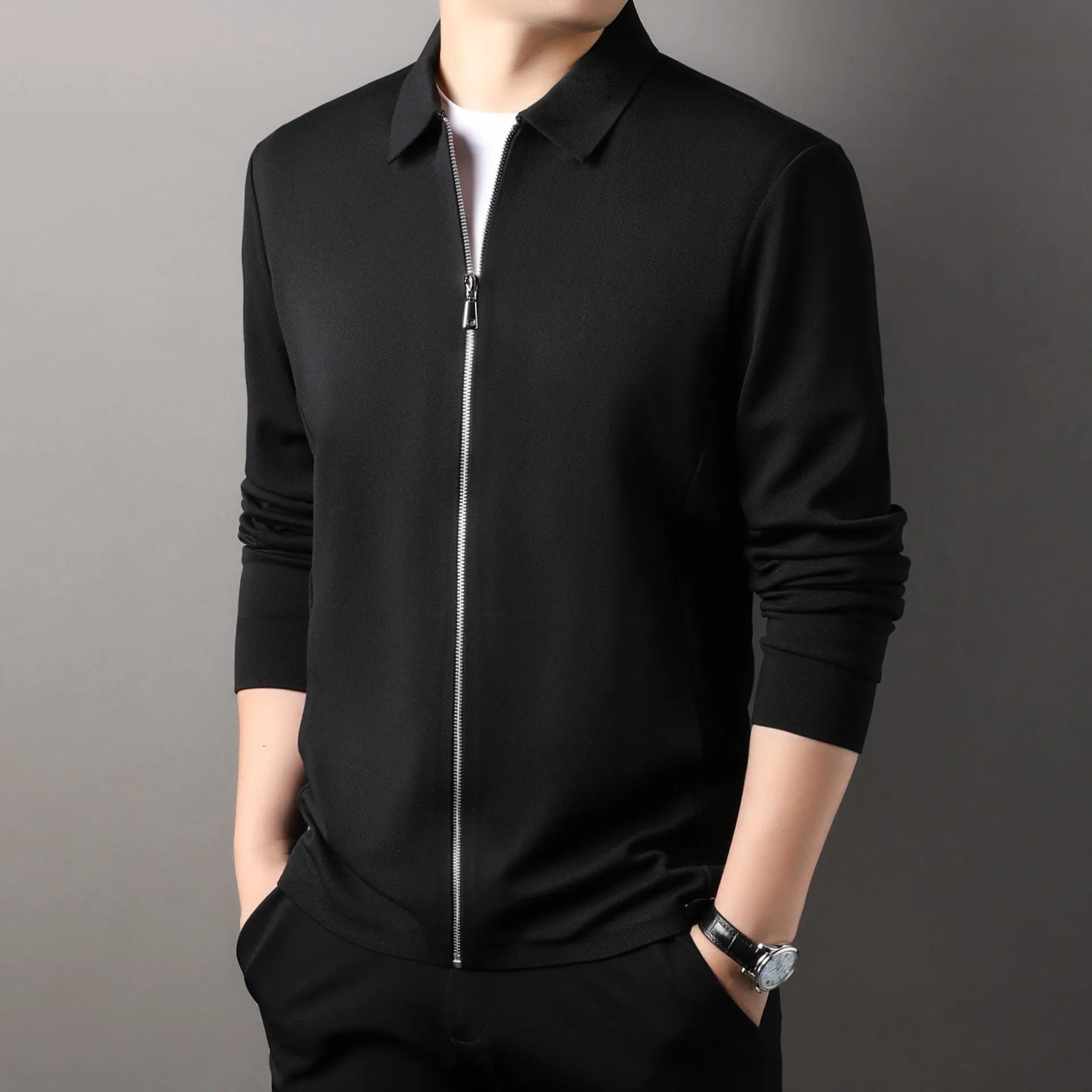 Men's jacket in apricot colour with straight hem and long sleeves, made from polyester fibre, shown on a hanger.