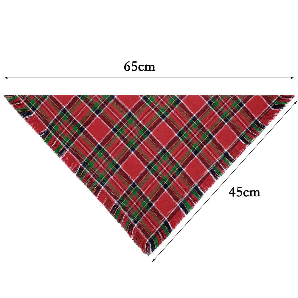 Plaid triangle dog bandana with tassel edges in autumn colours on a dog's neck.