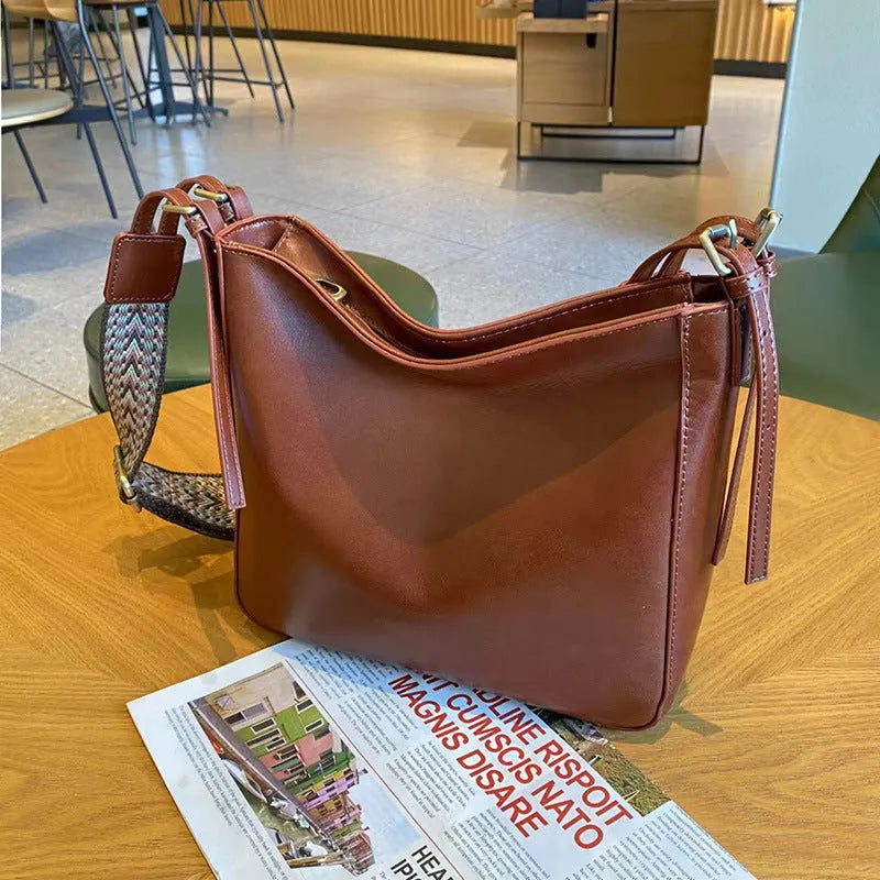 Women's large-capacity leather shoulder messenger bag in square vertical shape with multiple interior compartments
