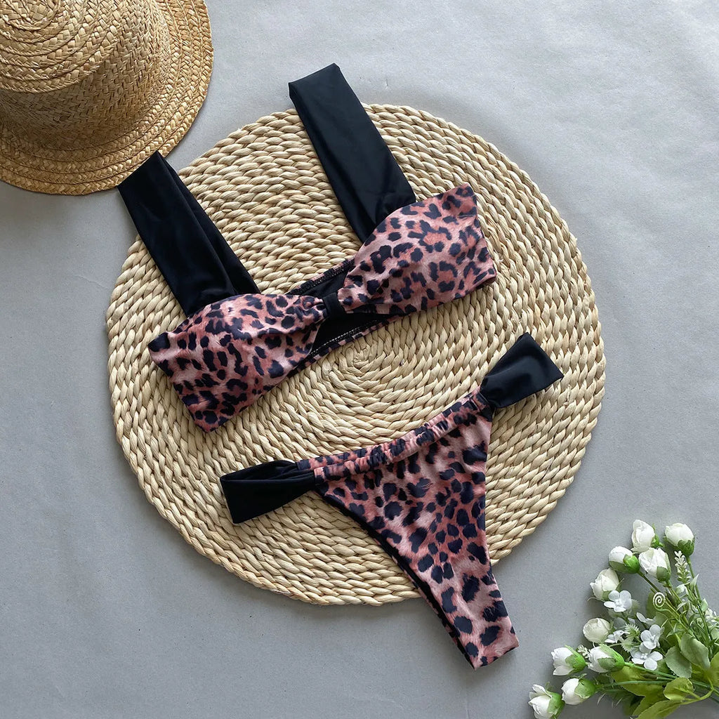 Women's leopard print bikini set with black split tube top and matching bottoms