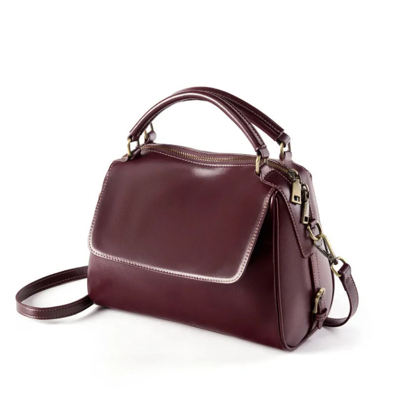 Women's soft genuine leather crossbody tote bag in apricot colour with slit pocket and double straps
