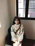 Women's milky white knitwear pullover with lantern sleeves and a loose fit.