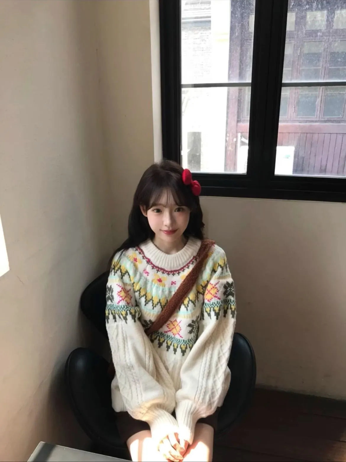 Women's milky white knitwear pullover with lantern sleeves and a loose fit.