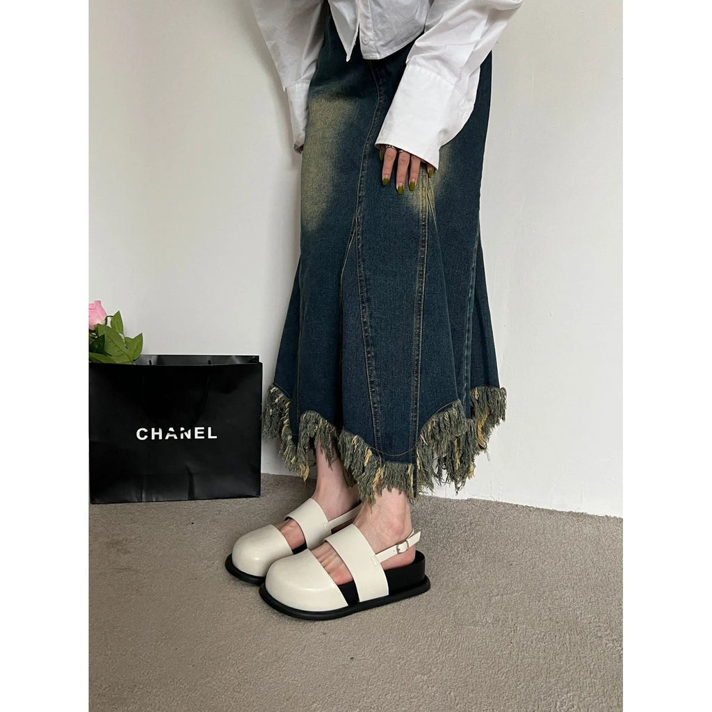 Retro raised sole sandals with ankle-strap buckle in black microfiber