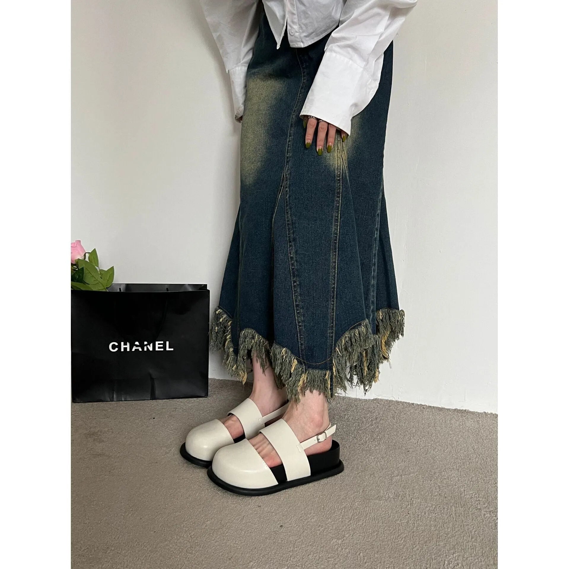 Retro raised sole sandals with ankle-strap buckle in black microfiber