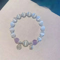 Glass butterfly bracelet for women with drop shape design and round decorative elements in moonlight grey colour