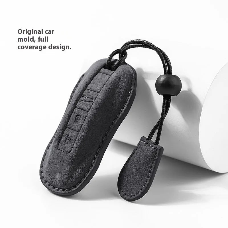 Suede car key cover in four colour options showing soft texture and key fob protection without branding