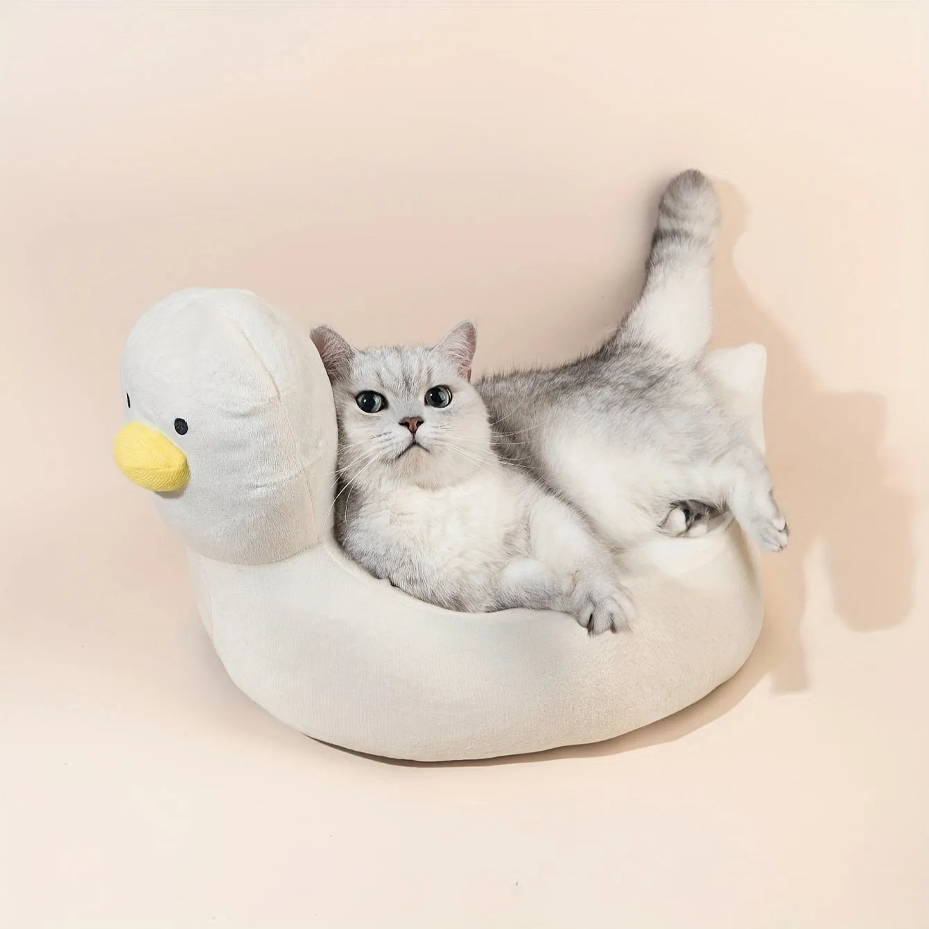 Duck-shaped pet bed sofa with fluffy polyester material in blue or white colour, showing raised sides and unique pattern design