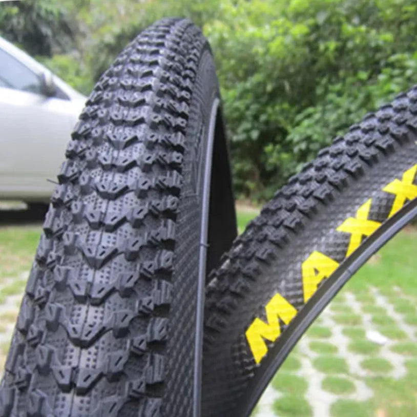 Mountain bike tyre showing tread pattern and sidewall with size markings