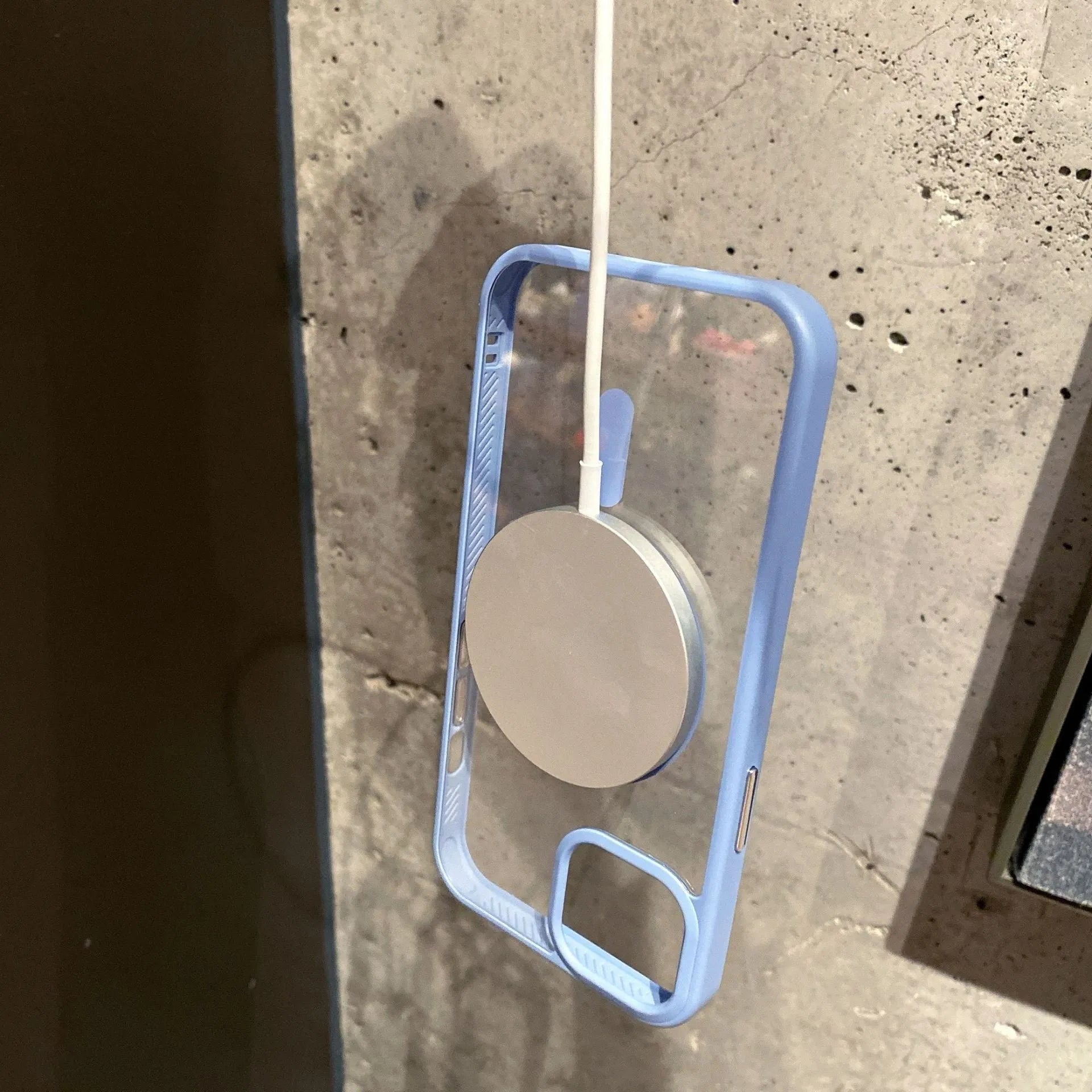 Transparent acrylic MagSafe phone case for iPhone with visible magnetic ring and TPU frame