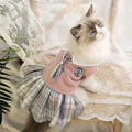Pink tartan princess-style skirt for small dog on white background showing full skirt design