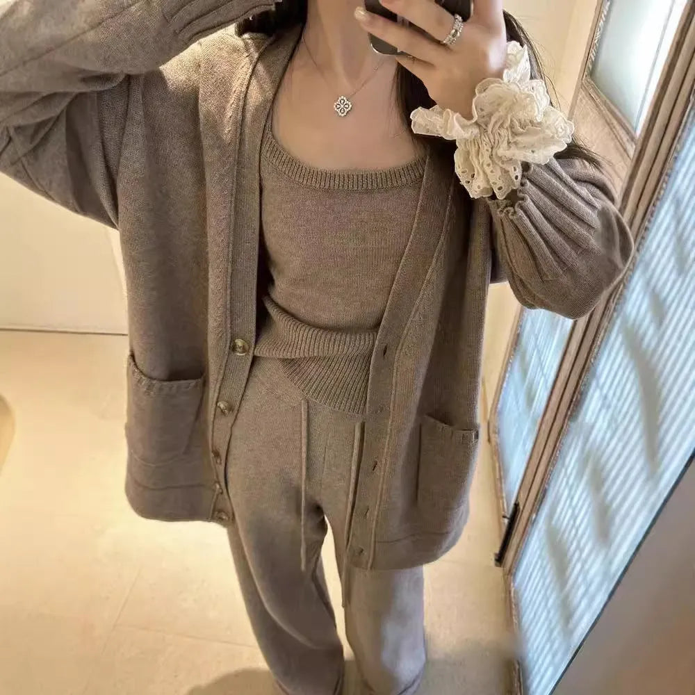 Women's wool blend knit three-piece set showing vest, cardigan coat, and pants in loose fit with seamless construction