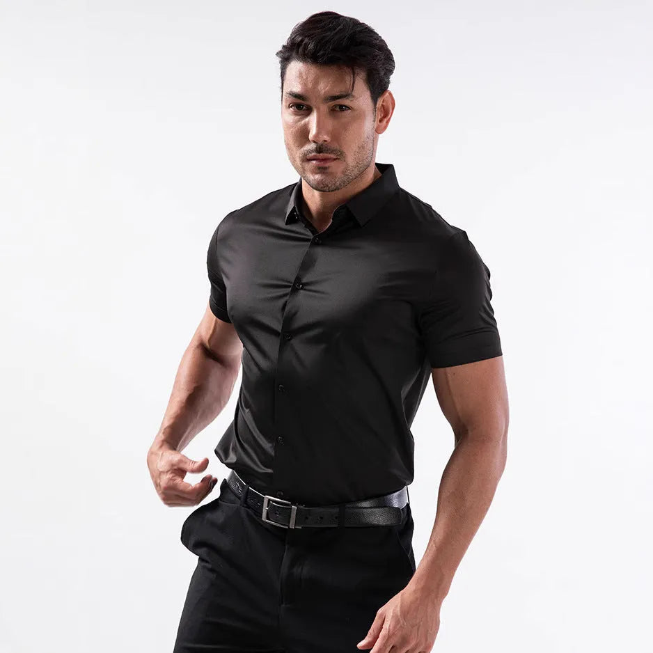 Man wearing a grey short sleeve cardigan-style shirt with four-side elastic, non-ironing fabric.