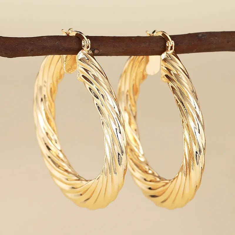 Geometric ring design ear clip earrings in copper with electroplated finish