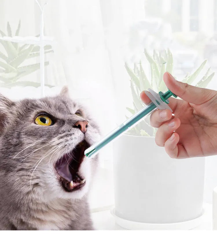Two silicone pet pill shooters showing 15cm length and soft-tip design for medication administration