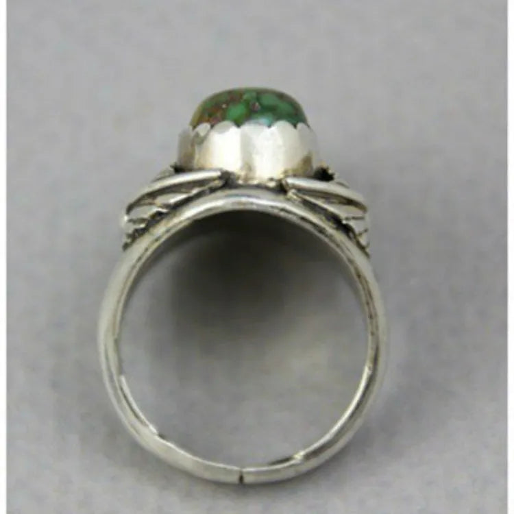Geometric turquoise ring with electroplated alloy construction showing stone setting detail