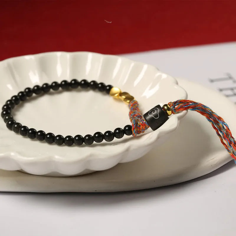 Hand-woven obsidian carrying strap with adjustable 15.5-16cm length and 4mm width, unisex design