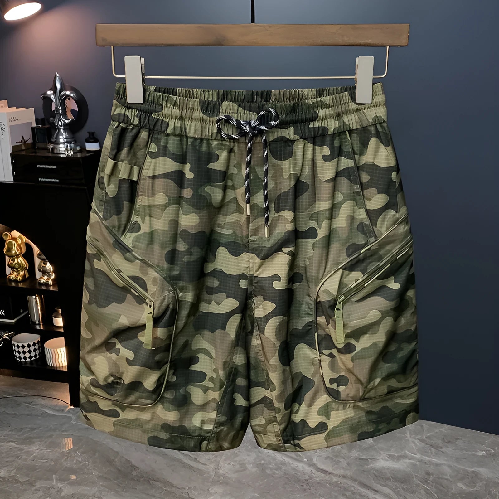Men's loose fit camouflage cargo shorts with cargo pockets on a mannequin.