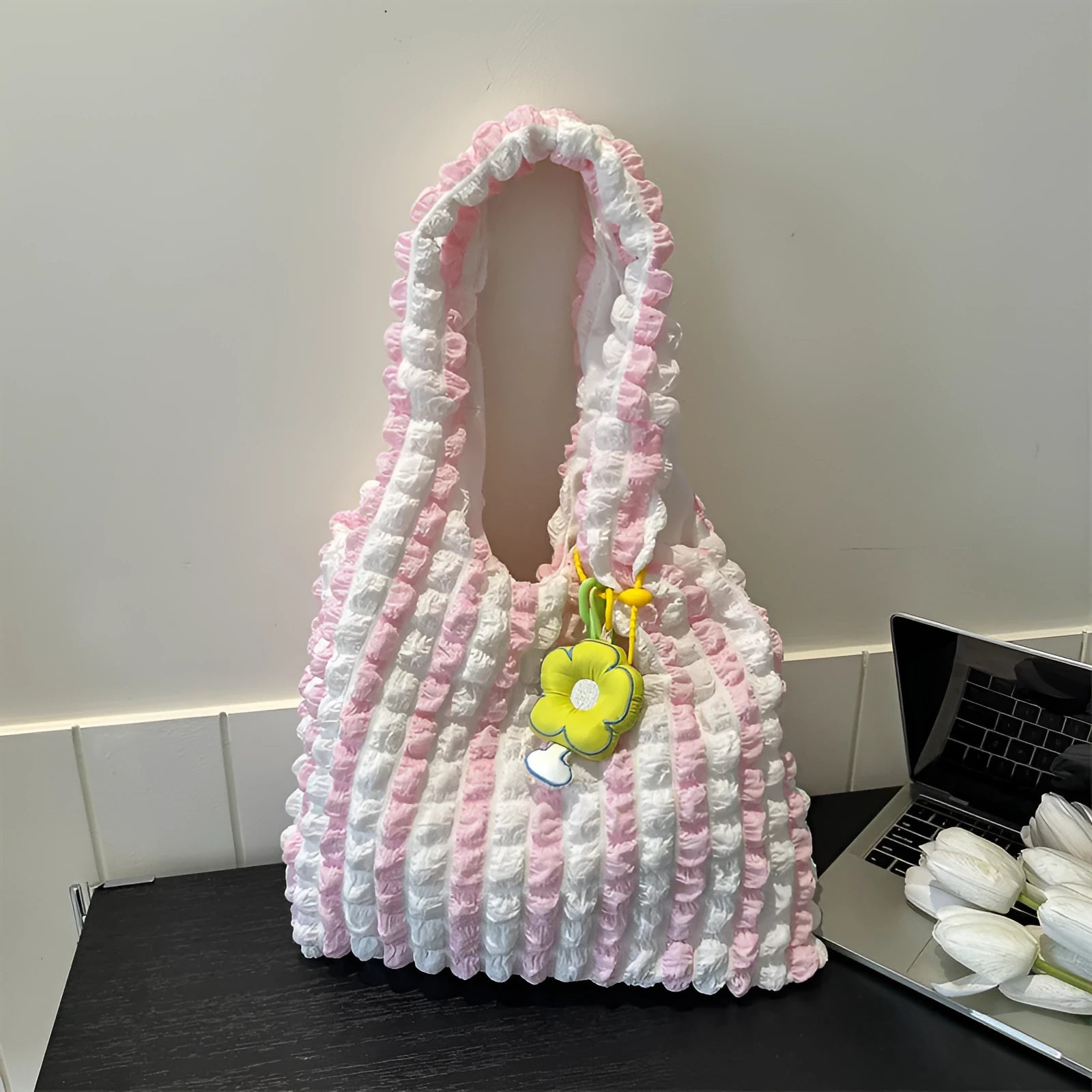 Soft square polyester shoulder bag with pleated bubble texture and an optional pendant, shown in multiple colours.