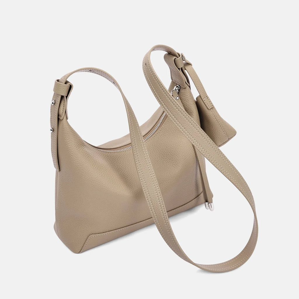 Simple grey genuine cowhide leather women's shoulder bag with visible stitching, shown on a neutral background.