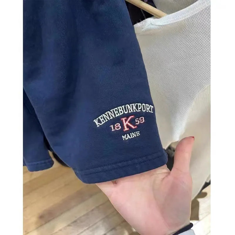 Women's dark blue cotton sports shorts with white flag embroidery and free size fit for athletic activities