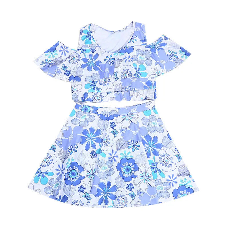 Blue floral patterned women's one-piece swim dress on hanger