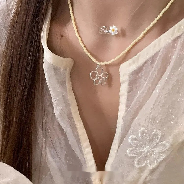 Women's hollow flower necklace with electroplated copper pendant and colourful beaded chain in Korean style