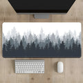 Large black desk mat with a detailed Chinese ink painting landscape design of mountains and trees on a natural rubber non-slip base.