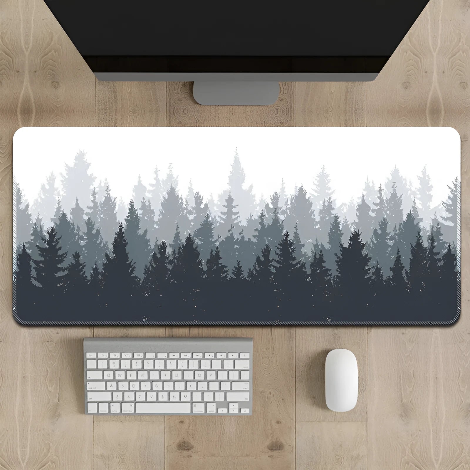 Large black desk mat with a detailed Chinese ink painting landscape design of mountains and trees on a natural rubber non-slip base.