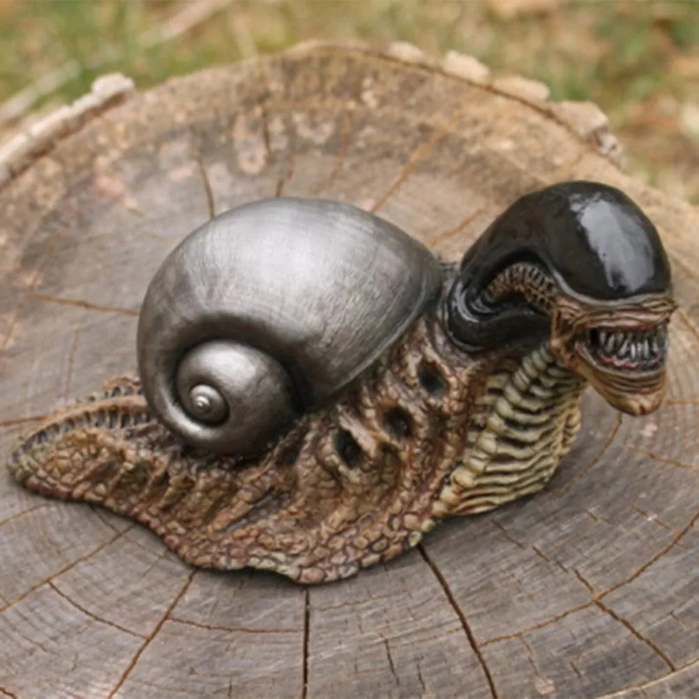 Minimalist white resin snail sculpture on a wooden surface for home or garden decor.